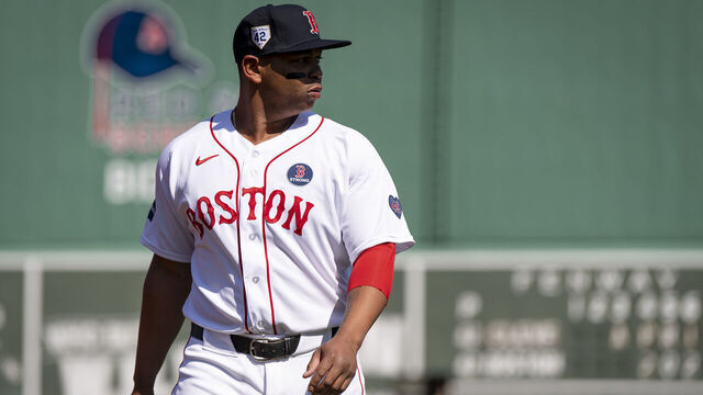 BOSTON, MA - APRIL 15: Rafael Devers #11 of the Boston Red Sox stretches before a game against the Cleveland Guardians on April 15, 2024 at Fenway Park in Boston, Massachusetts.