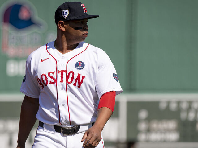 BOSTON, MA - APRIL 15: Rafael Devers #11 of the Boston Red Sox stretches before a game against the Cleveland Guardians on April 15, 2024 at Fenway Park in Boston, Massachusetts.