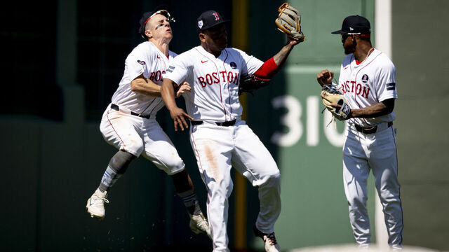 BOSTON, MA - APRIL 15: Tyler O'Neill #17 of the Boston Red Sox and Rafael Devers #11 of the Boston Red Sox collide during the seventh inning of a game against the Cleveland Guardians on April 15, 2024 at Fenway Park in Boston, Massachusetts.