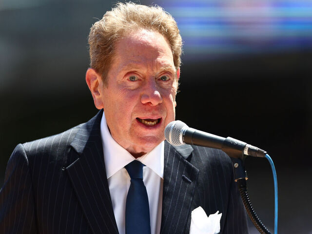 NEW YORK, NY - JULY 30: New York Yankees radio broadcaster John Sterling emcees the Old Timers Day Ceremony before a game between the Kansas City Royals and New York Yankees at Yankee Stadium on July 30, 2022 in New York City.