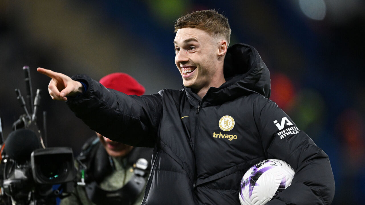 LONDON, ENGLAND - APRIL 15: Cole Palmer of Chelsea celebrates victory whilst holding the match ball, after scoring four goals in the Premier League match between Chelsea FC and Everton FC at Stamford Bridge on April 15, 2024 in London, England.