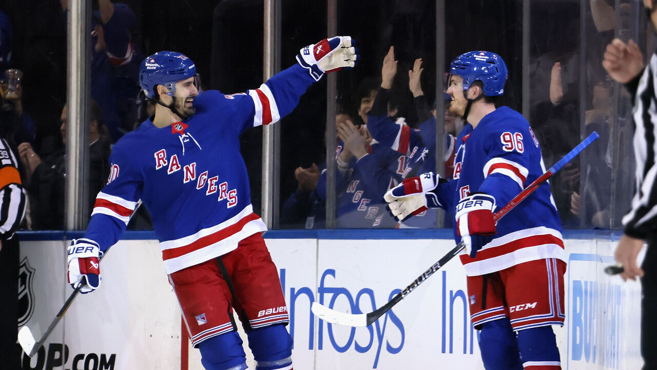 NEW YORK, NEW YORK - APRIL 15: Jack Roslovic #96 of the New York Rangers (R) celebrates his first period goal against the Ottawa Senators and is joined by Chris Kreider #20 (L) at Madison Square Garden on April 15, 2024 in New York City.