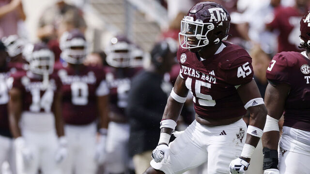 COLLEGE STATION, TX - OCTOBER 28: Texas A&M Aggies linebacker Edgerrin Cooper (45) and defensive lineman McKinnley Jackson (3) react after a tackle for loss during a college football game against the South Carolina Gamecocks on October 28, 2023 at Kyle Field in College Station, Texas.