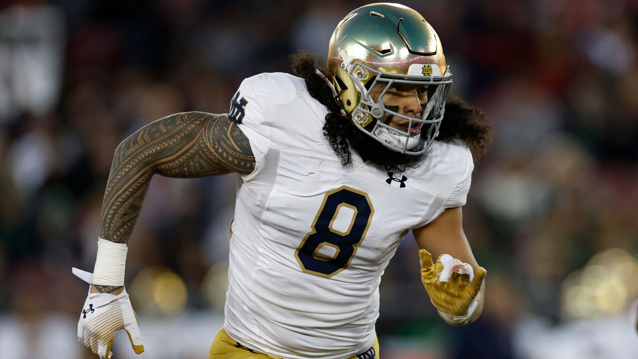 STANFORD, CALIFORNIA - NOVEMBER 25: Marist Liufau #8 of the Notre Dame Fighting Irish runs in the second half during a game against the Stanford Cardinal at Stanford Stadium on November 25, 2023 in Stanford, California.