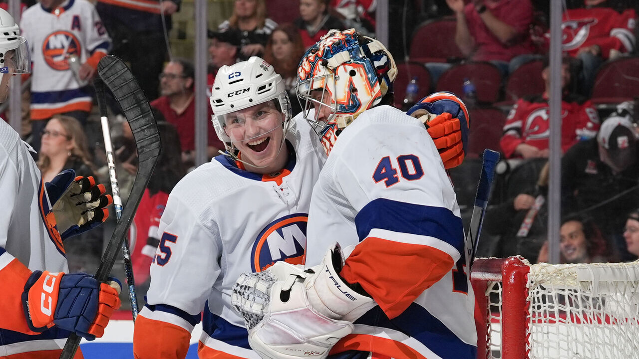NEWARK, NJ - APRIL 15: Semyon Varlamov #40 of the New York Islanders celebrates with Sebastian Aho #25 after winning the game against the New Jersey Devils at the Prudential Center on April 15, 2024 in Newark, New Jersey.