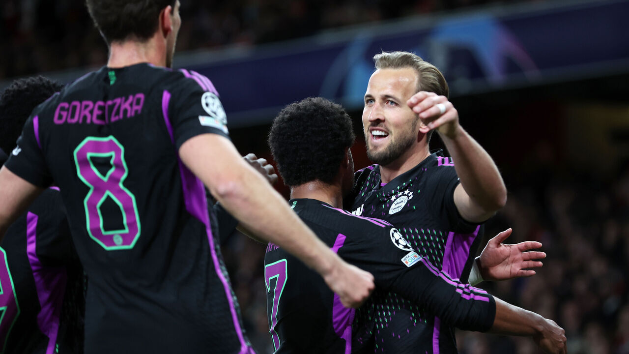 LONDON, ENGLAND - APRIL 9: Harry Kane of Bayern Munich celebrates with Serge Gnabry after scoring their second goal from a penalty during the UEFA Champions League quarter-final first leg match between Arsenal FC and FC Bayern München at Emirates Stadium on April 9, 2024 in London, England.