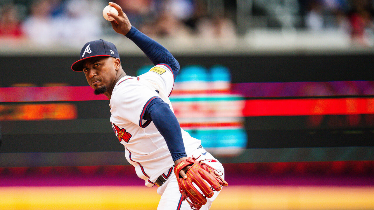 ATLANTA, GA - APRIL 11: Ozzie Albies #1 of the Atlanta Braves makes a throw to first during the fifth inning against the New York Mets at Truist Park on April 11, 2024 in Atlanta, Georgia.