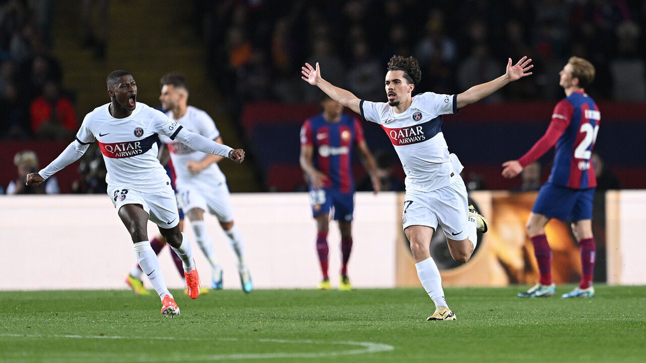BARCELONA, SPAIN - APRIL 16: Vitinha of Paris Saint-Germain celebrates scoring his team's second goal during the UEFA Champions League quarter-final second leg match between FC Barcelona and Paris Saint-Germain at Estadi Olimpic Lluis Companys on April 16, 2024 in Barcelona, Spain.