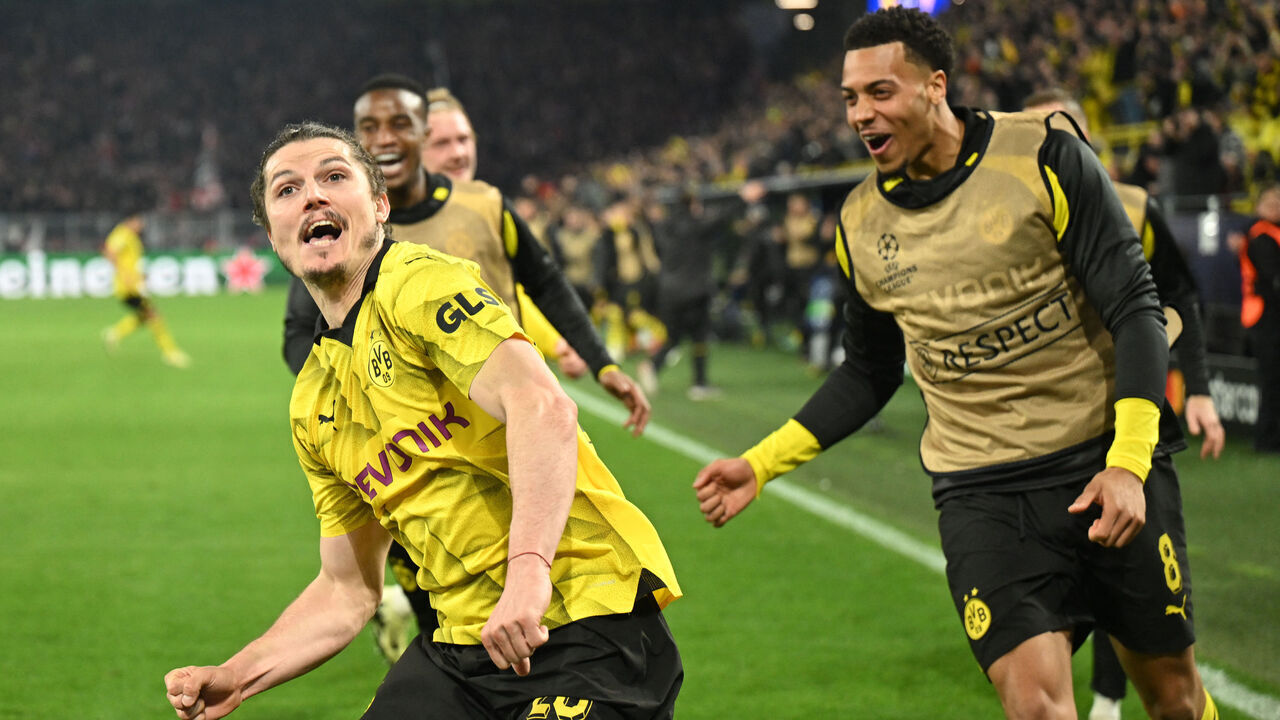 Dortmund's Austrian midfielder #20 Marcel Sabitzer celebrates scoring his team's forth goal 4:2 with his team mates during the UEFA Champions League quarter-final second leg football match between Borussia Dortmund and Atletico Madrid in Dortmund, western Germany on April 16, 2024.