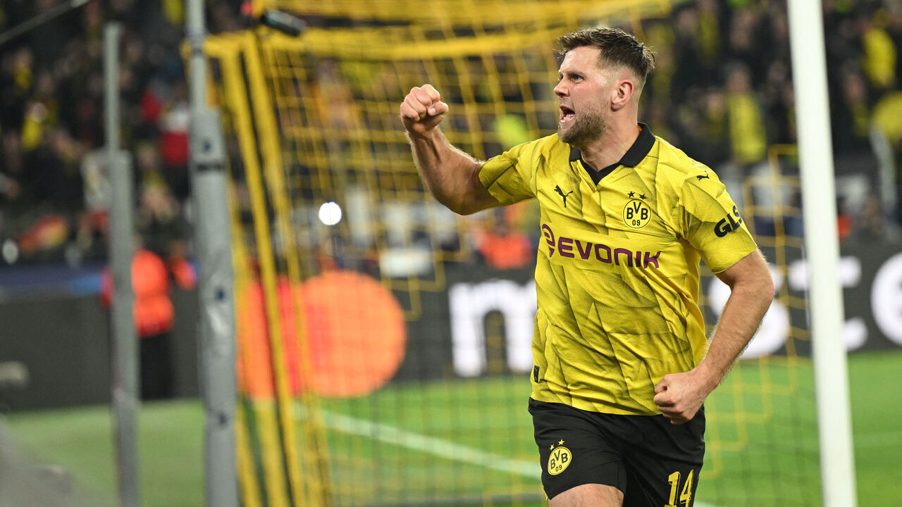 Dortmund's German forward #14 Niclas Fuellkrug celebrates scoring his team's third goal 3:2 during the UEFA Champions League quarter-final second leg football match between Borussia Dortmund and Atletico Madrid in Dortmund, western Germany on April 16, 2024.