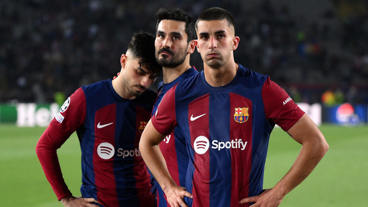 BARCELONA, SPAIN - APRIL 16: Pedri, Ilkay Guendogan and Ferran Torres of FC Barcelona look dejected after the team's defeat in the UEFA Champions League quarter-final second leg match between FC Barcelona and Paris Saint-Germain at Estadi Olimpic Lluis Companys on April 16, 2024 in Barcelona, Spain.