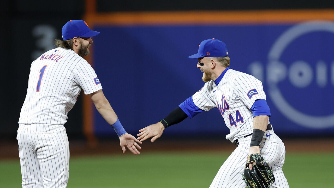 NEW YORK, NEW YORK - APRIL 16: Jeff McNeil #1, Harrison Bader #44, and Francisco Lindor #12 of the New York Mets celebrate after the ninth inning against the Pittsburgh Pirates at Citi Field on April 16, 2024 in the Queens borough of New York City. The Mets won 3-1.