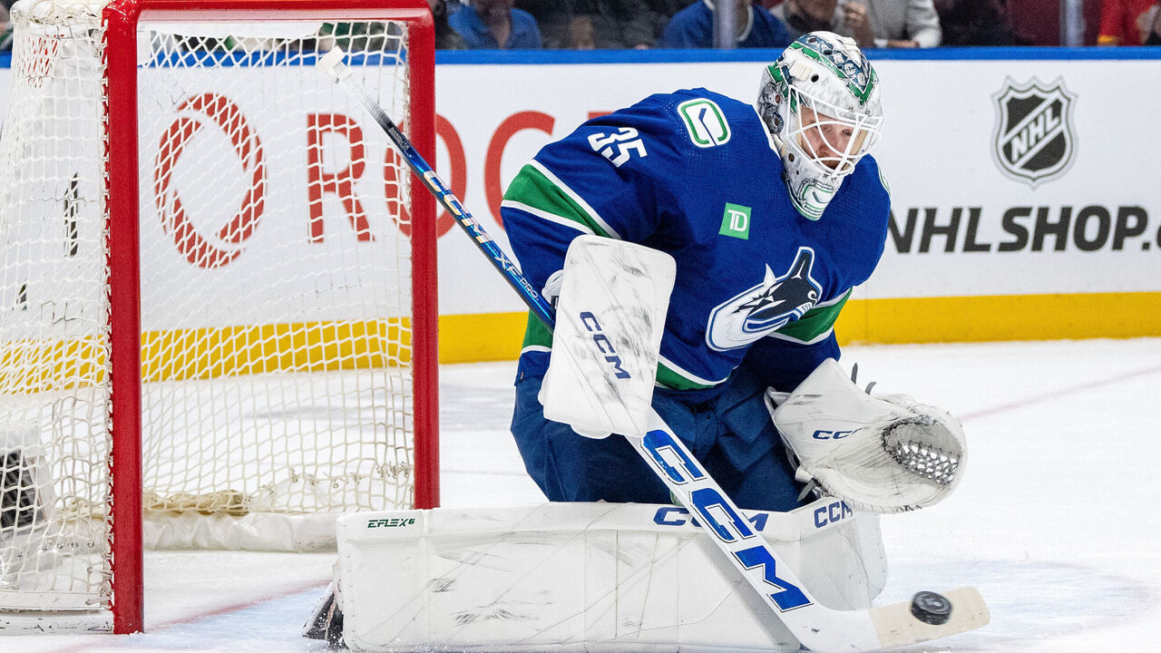 VANCOUVER, BC - APRIL 16: Vancouver Canucks goaltender Thatcher Demko (35) stops the puck during an NHL game between the Calgary Flames and the Vancouver Canucks on, Tuesday, April 16, 2024 at Rogers Arena in Vancouver, B.C.