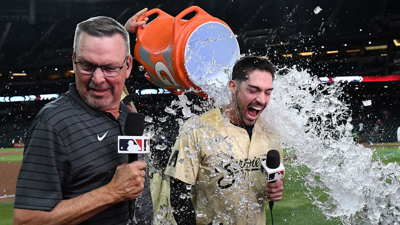 PHOENIX, ARIZONA - APRIL 16: Randal Grichuk #15 of the Arizona Diamondbacks is doused with iced water after hitting a walk off RBI double against the Chicago Cubs during the tenth inning at Chase Field on April 16, 2024 in Phoenix, Arizona. Dbacks won 12-11.