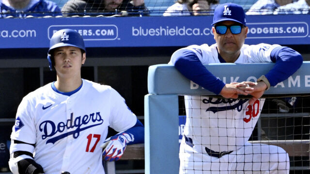 Los Angeles, CA - March 28: Shohei Ohtani #17 along with manager Dave Roberts #40 of the Los Angeles Dodgers look on against the St. Louis Cardinals in the eighth inning of a opening day baseball game at Dodger Stadium in Los Angeles on Thursday, March 28, 2024.