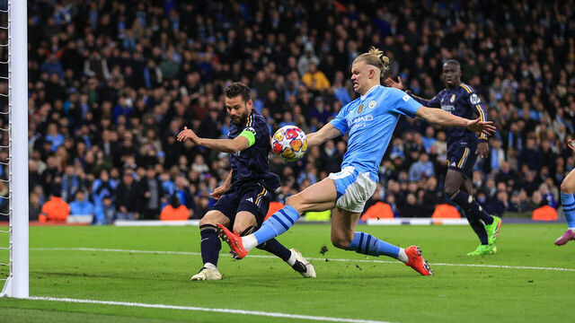 MANCHESTER, ENGLAND - APRIL 17: Nacho Fernandez of Real Madrid clears the ball from Erling Haaland of Manchester City during the UEFA Champions League quarter-final second leg match between Manchester City and Real Madrid CF at Etihad Stadium on April 17, 2024 in Manchester, England.