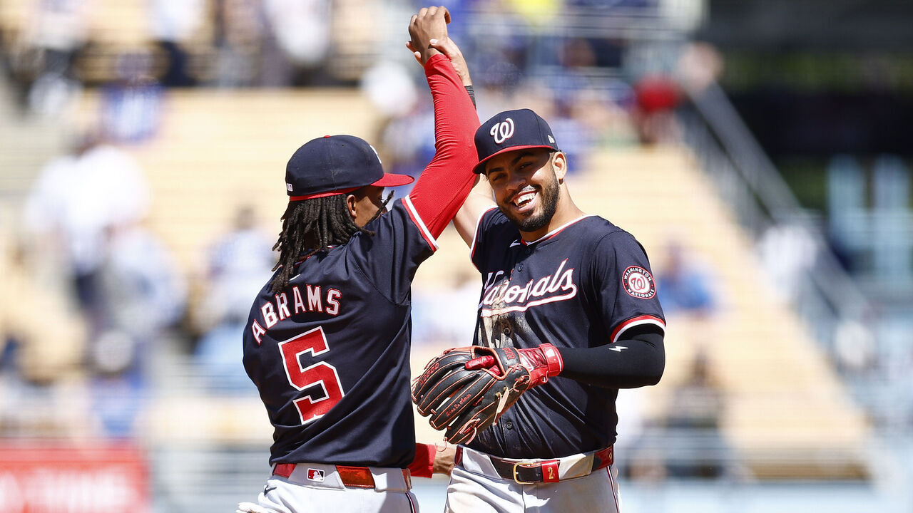 LOS ANGELES, CALIFORNIA - APRIL 17: CJ Abrams #5 and Luis García Jr. #2 of the Washington Nationals celebrate a 2-1 win against the Los Angeles Dodgers at Dodger Stadium on April 17, 2024 in Los Angeles, California.