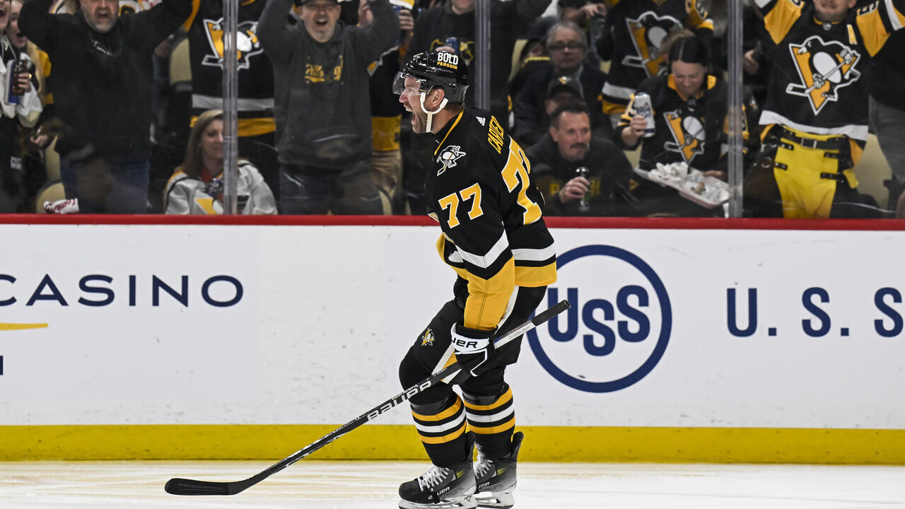 PITTSBURGH, PA - APRIL 11: Pittsburgh Penguins center Jeff Carter (77) celebrates his goal during the third period in the NHL game between the Pittsburgh Penguins and the Detroit Red Wings on April 11, 2024, at PPG Paints Arena in Pittsburgh, PA.