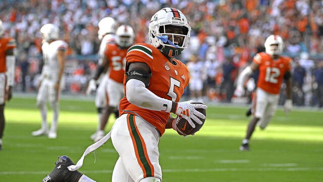MIAMI GARDENS, FL - OCTOBER 28: Miami safety Kamren Kinchens (5) celebrates after returning an interception 29 yards for a touchdown in the third quarter as the Miami Hurricanes faced the Virginia Cavaliers on October 28, 2023, at Hard Rock Stadium in Miami Gardens, Florida.