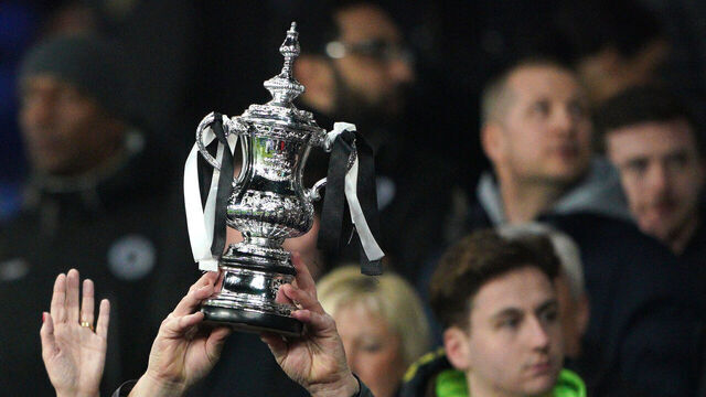 Boreham Wood fans in the stands hold up an FA Cup replica trophy before the Emirates FA Cup fifth round match at Goodison Park, Liverpool. Picture date: Thursday March 3, 2022.