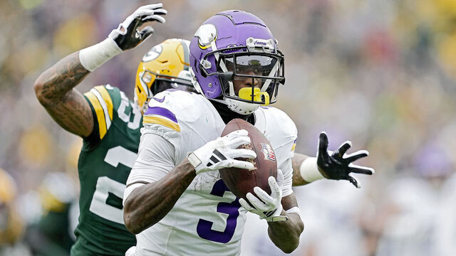 GREEN BAY, WISCONSIN - OCTOBER 29: Jordan Addison #3 of the Minnesota Vikings catches a pass for a touchdown during the third quarter of a game against the Green Bay Packers at Lambeau Field on October 29, 2023 in Green Bay, Wisconsin.