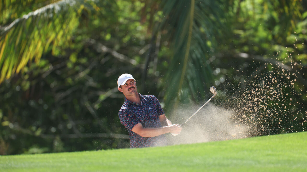 PUNTA CANA, DOMINICAN REPUBLIC - APRIL 18: Wesley Bryan of the United States plays a shot from a bunker on the 14th hole during the first round of the Corales Puntacana Championship at Puntacana Resort & Club, Corales Golf Course on April 18, 2024 in Punta Cana, Dominican Republic.
