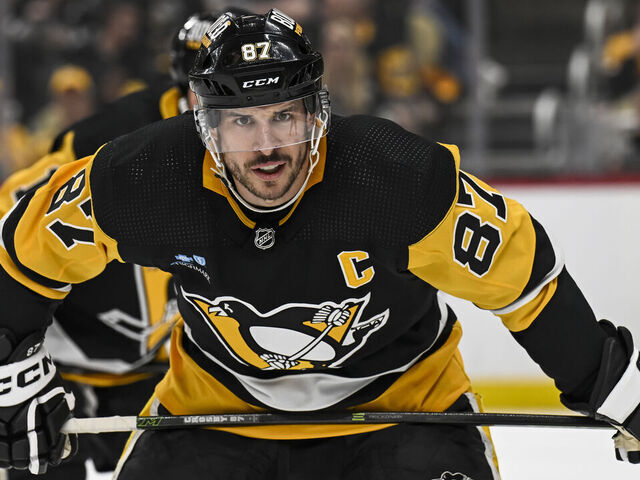 PITTSBURGH, PA - APRIL 15: Pittsburgh Penguins center Sidney Crosby (87) waits for a faceoff during the first period in the NHL game between the Pittsburgh Penguins and the Nashville Predators on April 15, 2024, at PPG Paints Arena in Pittsburgh, PA.
