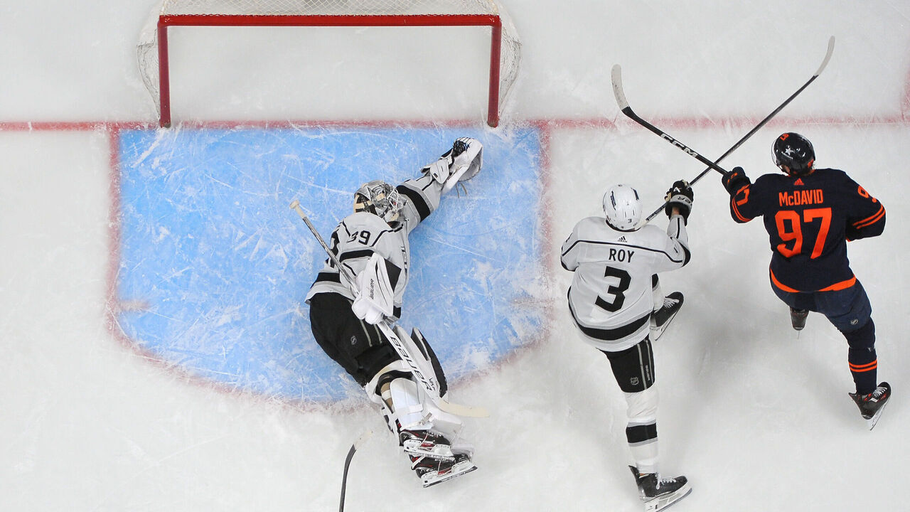 EDMONTON, CANADA - MARCH 28: Connor McDavid #97 of the Edmonton Oilers scores a first-period goal against Cam Talbot #39 of the Los Angeles Kings at Rogers Place on March 28, 2024, in Edmonton, Alberta, Canada.