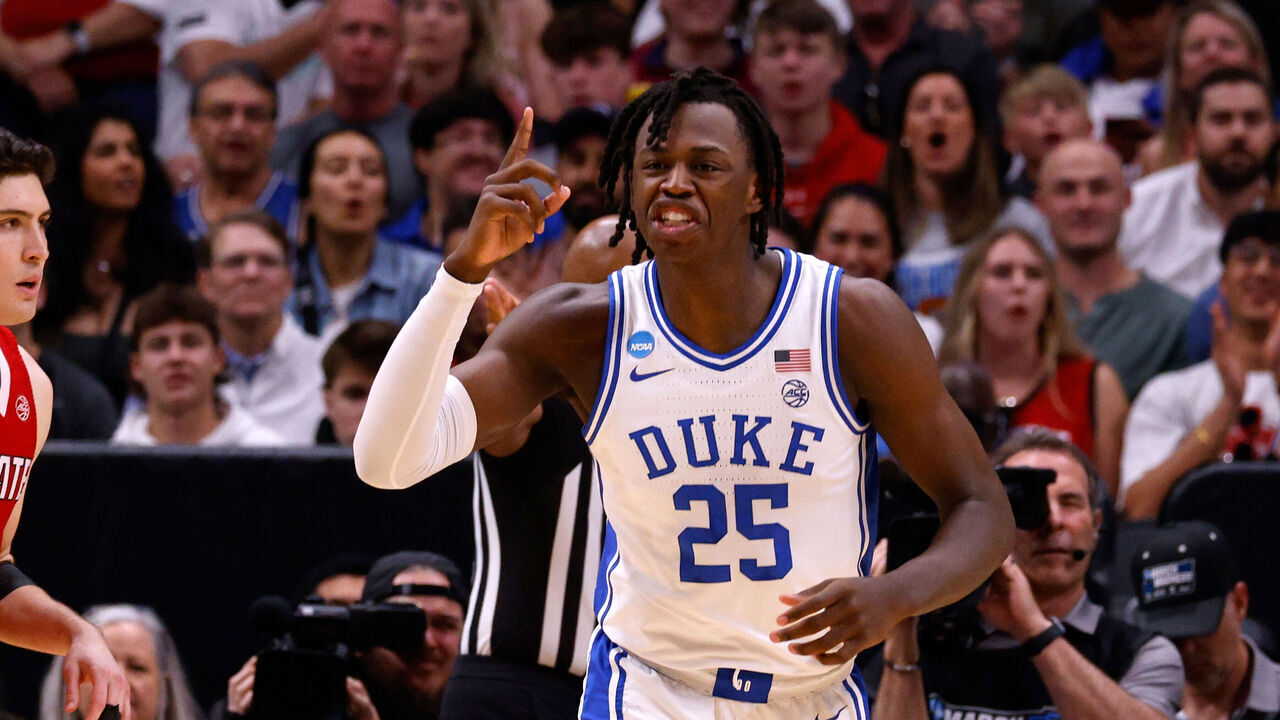 DALLAS, TEXAS - MARCH 31: Mark Mitchell #25 of the Duke Blue Devils reacts during the first half against the NC State Wolfpack in the Elite 8 round of the NCAA Men's Basketball Tournament at American Airlines Center on March 31, 2024 in Dallas, Texas.