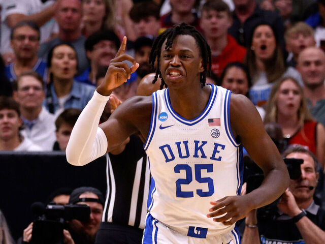 DALLAS, TEXAS - MARCH 31: Mark Mitchell #25 of the Duke Blue Devils reacts during the first half against the NC State Wolfpack in the Elite 8 round of the NCAA Men's Basketball Tournament at American Airlines Center on March 31, 2024 in Dallas, Texas.