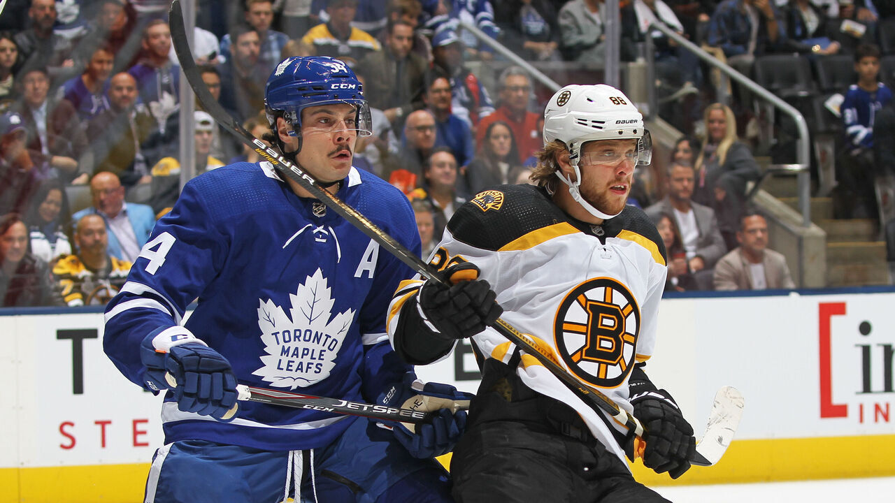TORONTO, ON - OCTOBER 19: David Pastrnak #88 of the Boston Bruins skates against Auston Matthews #34 of the Toronto Maple Leafs during an NHL game at Scotiabank Arena on October 19, 2019 in Toronto, Ontario, Canada.