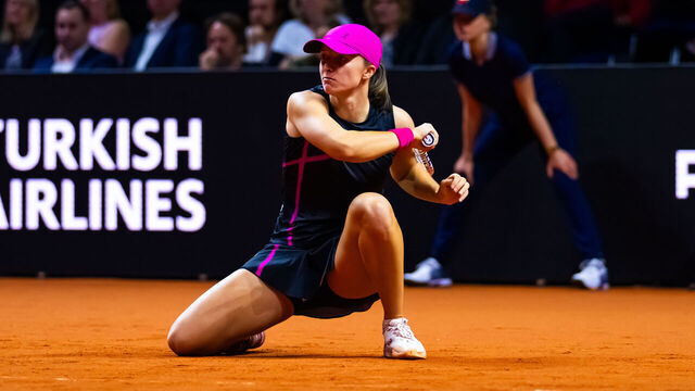 STUTTGART, GERMANY - APRIL 19: Iga Swiatek of Poland in action against Emma Raducanu of Great Britain in the quarter-final on Day Five of the Porsche Tennis Grand Prix Stuttgart 2024 at Porsche Arena on April 19, 2024 in Stuttgart, Germany