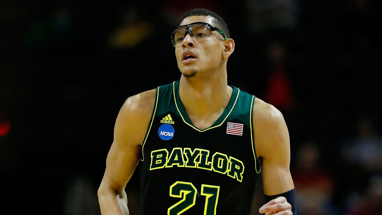 SAN ANTONIO, TX - MARCH 23: Isaiah Austin #21 of the Baylor Bears runs up the floor against the Creighton Bluejays during the third round of the 2014 NCAA Men's Basketball Tournament at the AT&T Center on March 23, 2014 in San Antonio, Texas.
