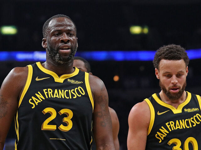 MEMPHIS, TENNESSEE - JANUARY 15: Draymond Green #23 of the Golden State Warriors and Stephen Curry #30 of the Golden State Warriors walk off the court during the first half against the Memphis Grizzlies at FedExForum on January 15, 2024 in Memphis, Tennessee.