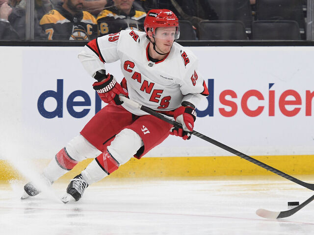 BOSTON, MASSACHUSETTS - APRIL 9: Jake Guentzel #59 of the Carolina Hurricanes skates with the puck against the Boston Bruins at the TD Garden on April 9, 2024 in Boston, Massachusetts.
