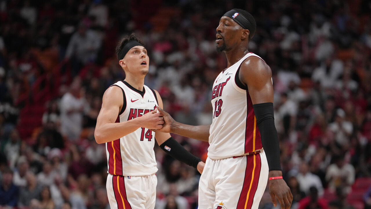 MIAMI, FL - APRIL 19: Tyler Herro #14 and Bam Adebayo #13 of the Miami Heat shake hands during the game against the Chicago Bulls during the 2024 SoFi Play-In Tournament on April 19, 2024 at Kaseya Center in Miami, Florida. Mandatory Copyright Notice: Copyright 2024 NBAE