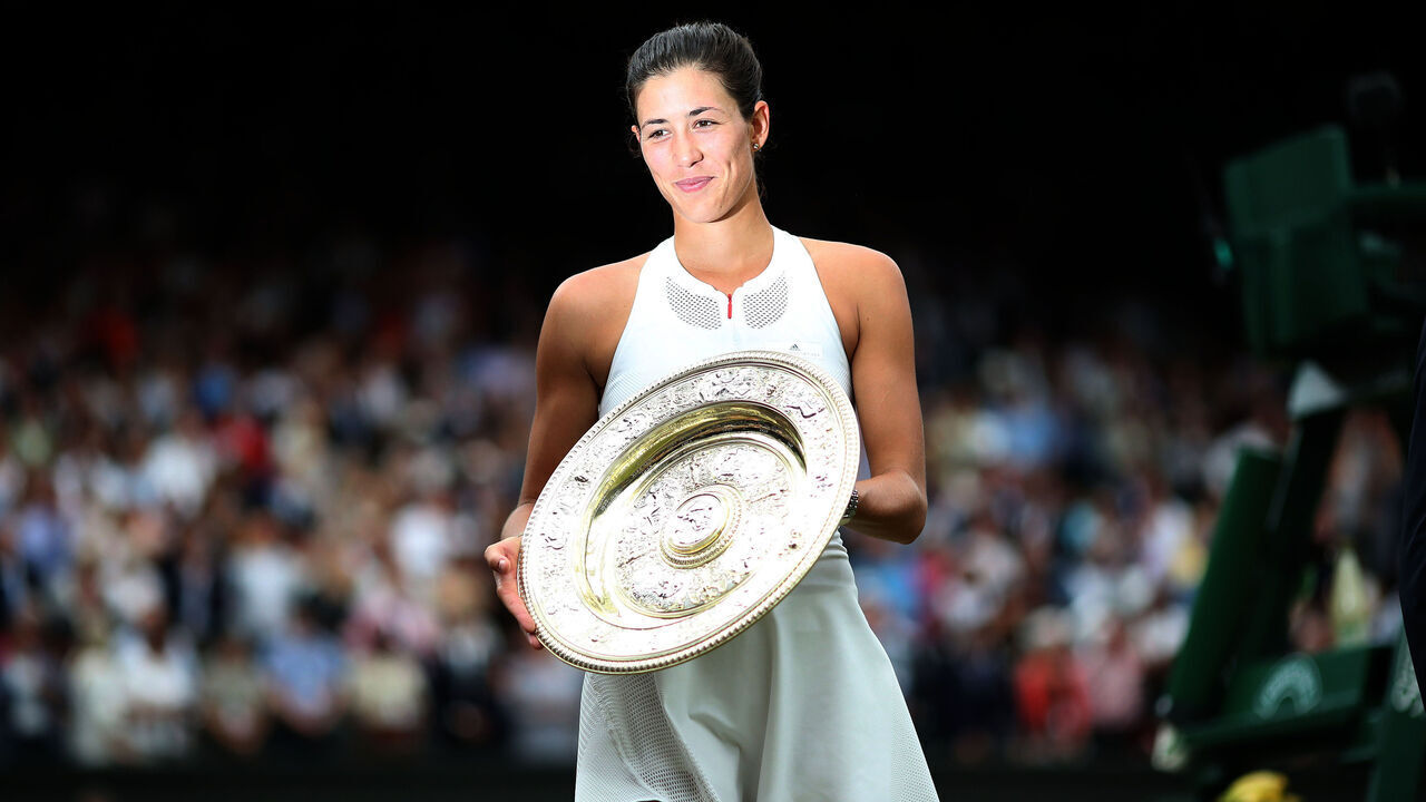 LONDON, ENGLAND - JULY 15: Garbine Muguruza of Spain with the winners trophy after victory in the Ladies Singles final defeating Venus Williams of The United States during the Wimbledon Lawn Tennis Championships at the All England Lawn Tennis and Croquet Club at Wimbledon on July 15, 2017 in London, England.