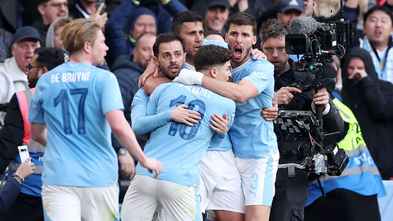 LONDON, ENGLAND - APRIL 20: Bernardo Silva celebrates scoring his team's first goal with teammates Julian Alvarez, Rodri and Ruben Dias of Manchester City during the Emirates FA Cup Semi Final match between Manchester City and Chelsea at Wembley Stadium on April 20, 2024 in London, England.