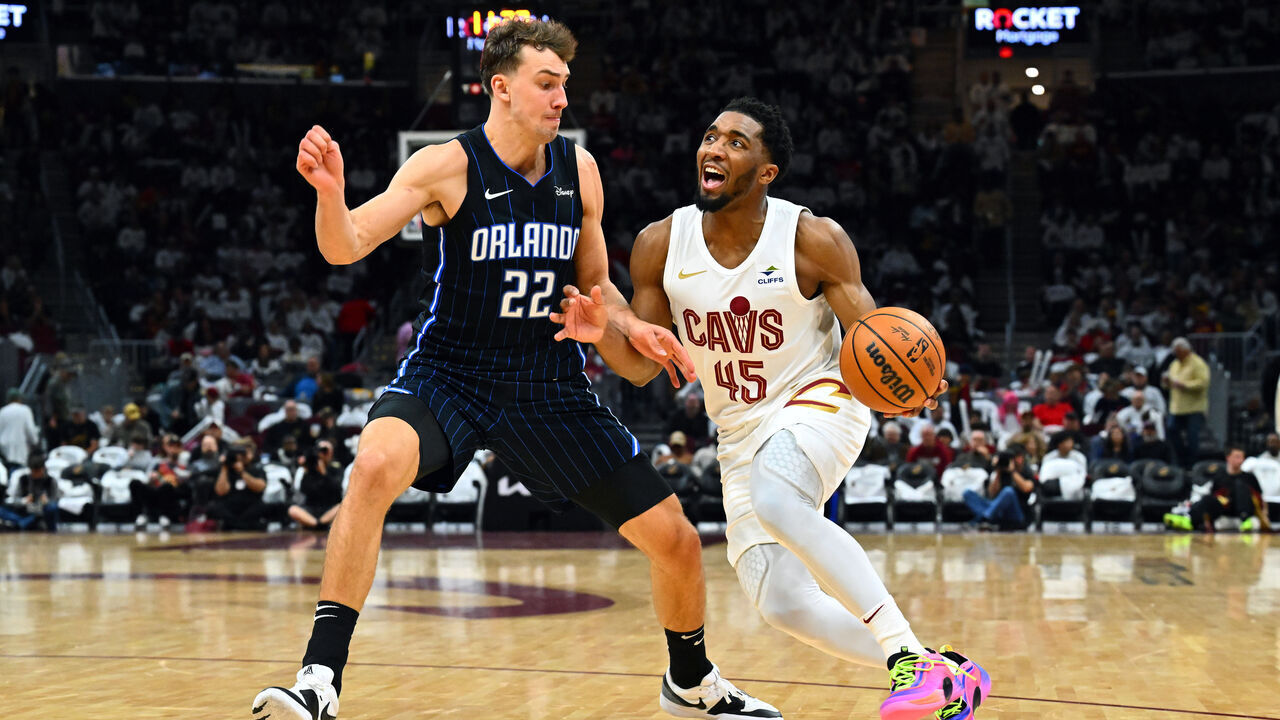 CLEVELAND, OHIO - APRIL 20: Franz Wagner #22 of the Orlando Magic guards Donovan Mitchell #45 of the Cleveland Cavaliers during the third quarter of game one of the Eastern Conference First Round Playoffs at Rocket Mortgage Fieldhouse on April 20, 2024 in Cleveland, Ohio. The Cavaliers defeated the Magic 97-83.