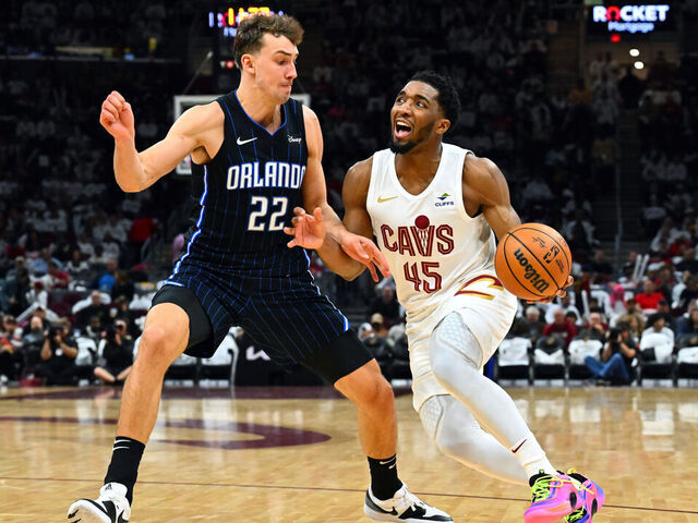 CLEVELAND, OHIO - APRIL 20: Franz Wagner #22 of the Orlando Magic guards Donovan Mitchell #45 of the Cleveland Cavaliers during the third quarter of game one of the Eastern Conference First Round Playoffs at Rocket Mortgage Fieldhouse on April 20, 2024 in Cleveland, Ohio. The Cavaliers defeated the Magic 97-83.
