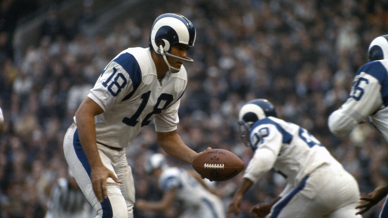 UNSPECIFIED - CIRCA 1970: Roman Gabriel #18 of the Los Angeles Rams turns to hand the ball off to a running back during an NFL football game circa 1969. Gabriel played for the Rams from 1962-72.