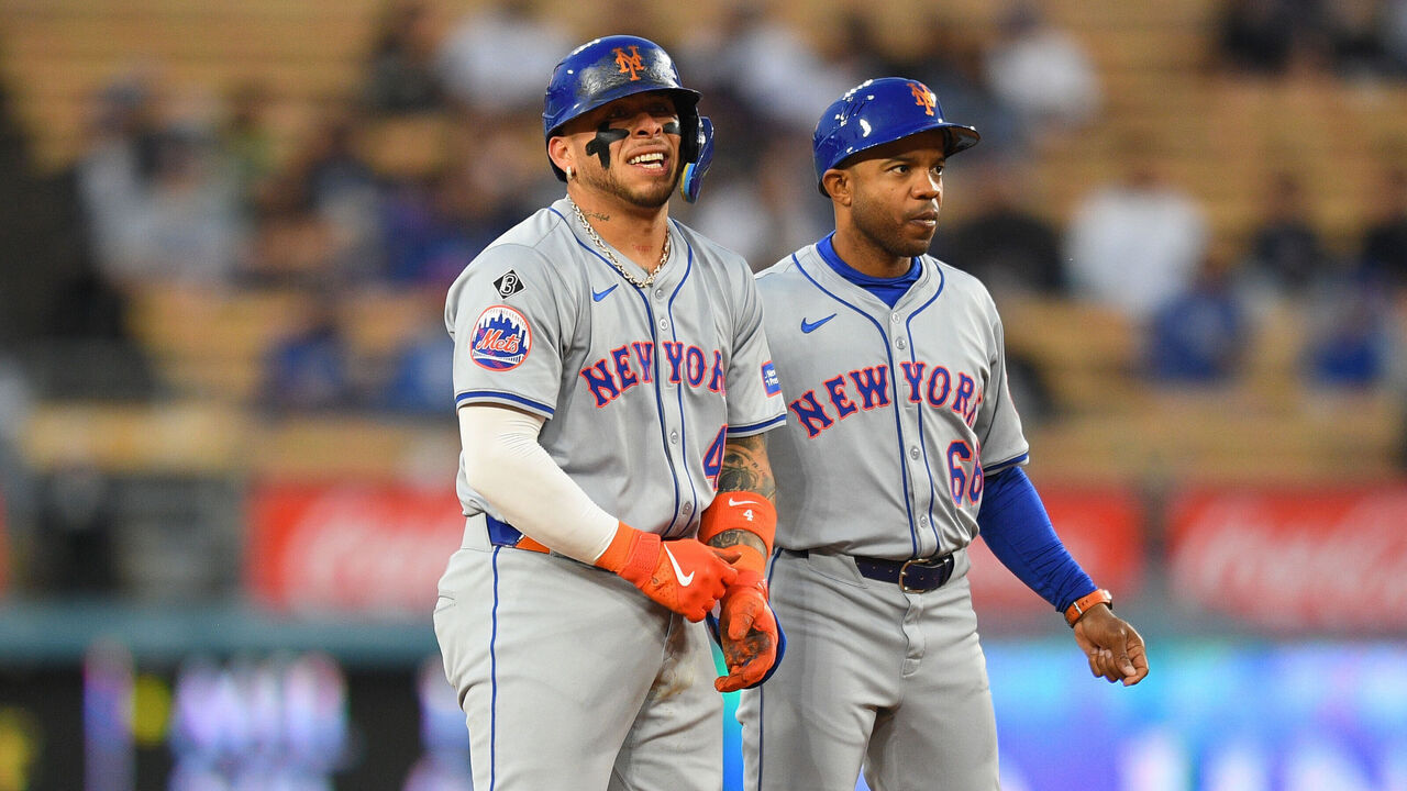 LOS ANGELES, CA - APRIL 19: New York Mets catcher Francisco Alvarez (4) is looked at by first base coach Antoan Richardson after being injured during the MLB game between the New York Mets and the Los Angeles Dodgers on April 19, 2024 at Dodger Stadium in Los Angeles, CA.