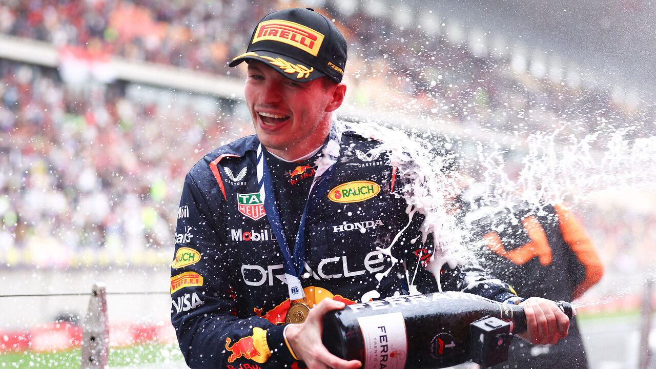 SHANGHAI, CHINA - APRIL 21: Race winner Max Verstappen of the Netherlands and Oracle Red Bull Racing celebrates on the podium after the F1 Grand Prix of China at Shanghai International Circuit on April 21, 2024 in Shanghai, China.