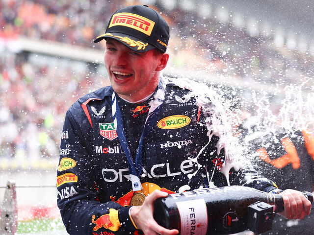 SHANGHAI, CHINA - APRIL 21: Race winner Max Verstappen of the Netherlands and Oracle Red Bull Racing celebrates on the podium after the F1 Grand Prix of China at Shanghai International Circuit on April 21, 2024 in Shanghai, China.