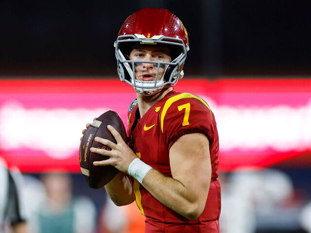 SAN DIEGO, CALIFORNIA - DECEMBER 27: Miller Moss #7 of the USC Trojans looks for an open receiver in the second half during the DIRECTV Holiday Bowl game against the Louisville Cardinals at Petco Park on December 27, 2023 in San Diego, California.