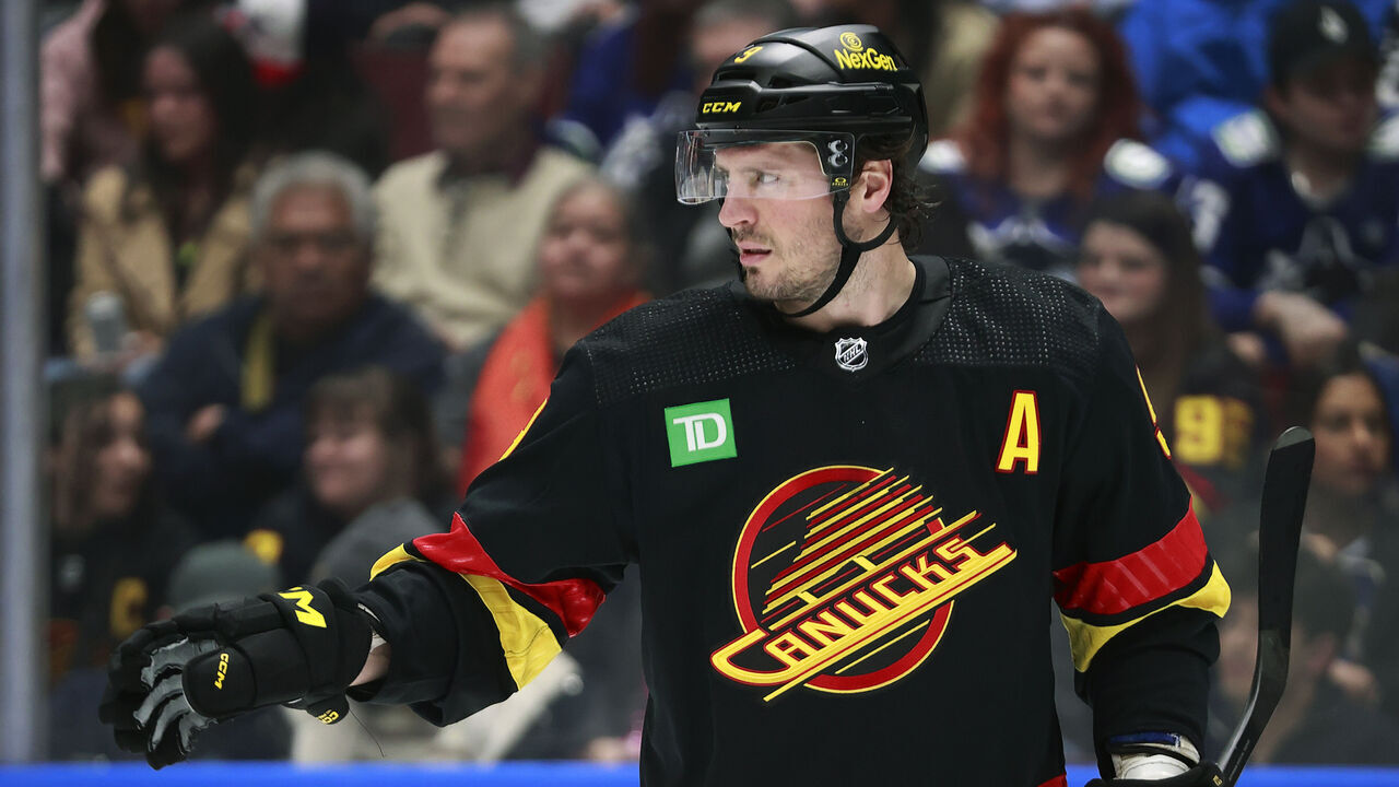 VANCOUVER, CANADA - APRIL 10: J.T. Miller #9 of the Vancouver Canucks lines up for a face off during their NHL game against the Arizona Coyotes at Rogers Arena on April 10, 2024 in Vancouver, British Columbia, Canada.
