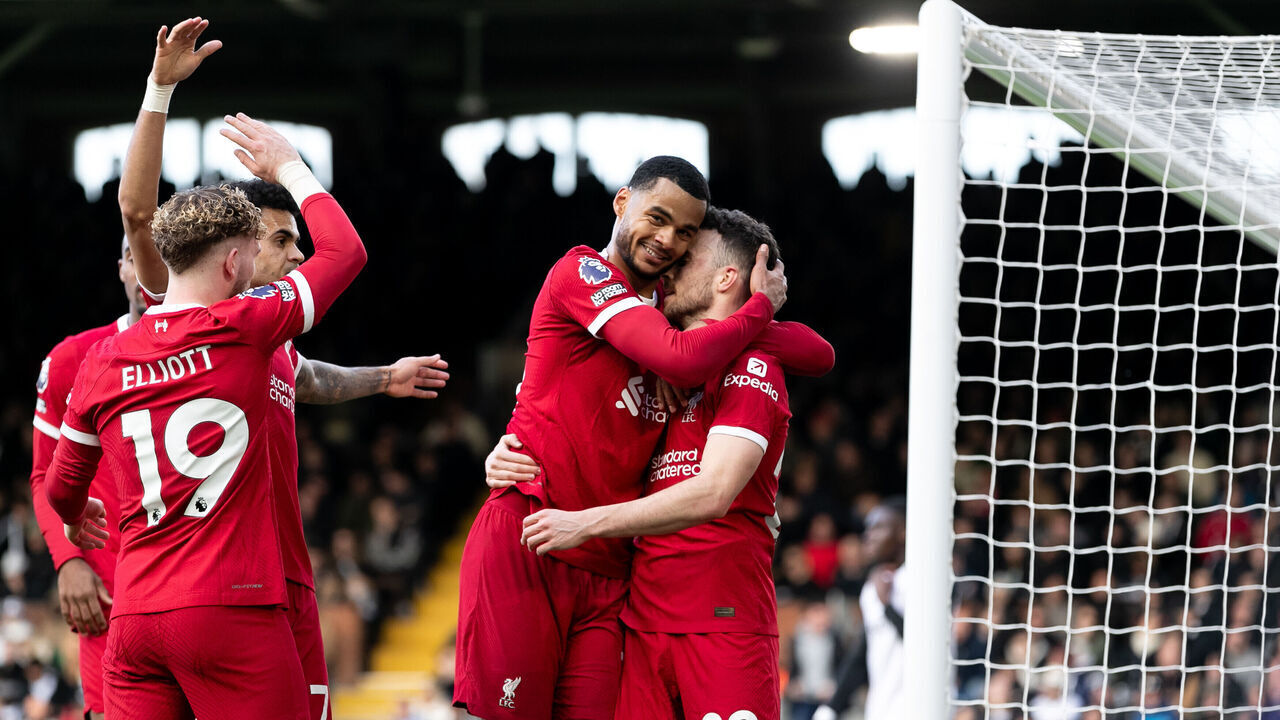 LONDON, ENGLAND - APRIL 21: Diogo Jota of Liverpool celebrates with Cody Gakpo of Liverpool after scoring his side's third goal during the Premier League match between Fulham FC and Liverpool FC at Craven Cottage on April 21, 2024 in London, England.