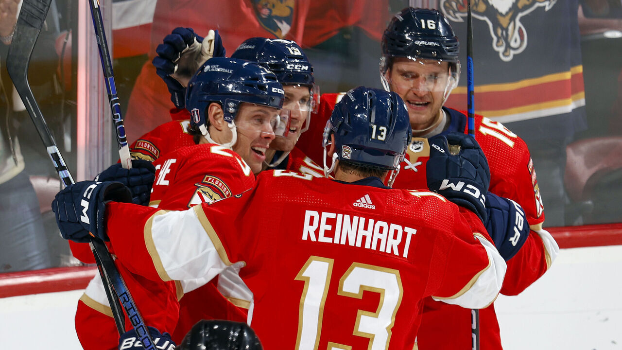 SUNRISE, FL - APRIL 21: Teammates congratulate Carter Verhaeghe #23 of the Florida Panthers after he scored a third period goal against the Tampa Bay Lightning in Game One of the First Round of the 2024 Stanley Cup Playoffs at the Amerant Bank Arena on April 21, 2024 in Sunrise, Florida.