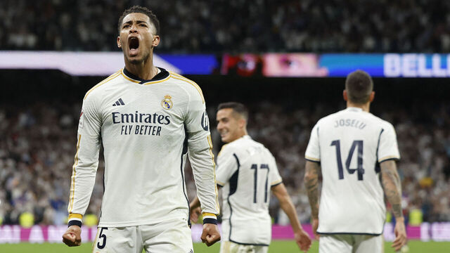 Real Madrid's English midfielder #5 Jude Bellingham celebrates scoring his team's third goal during the Spanish league football match between Real Madrid CF and FC Barcelona at the Santiago Bernabeu stadium in Madrid on April 21, 2024.