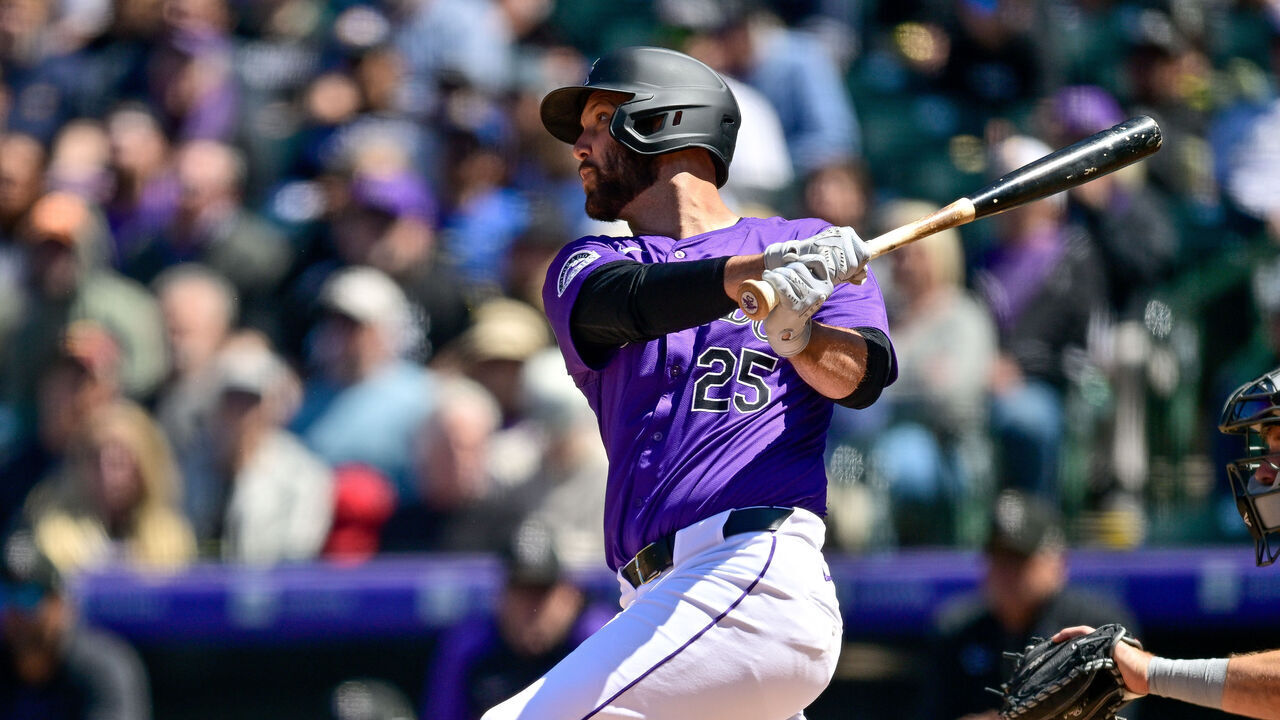 DENVER, CO - APRIL 21: Colorado Rockies catcher Jacob Stallings (25) doubles in the third inning during a game between the Seattle Mariners and the Colorado Rockies at Coors Field on April 21, 2024 in Denver, Colorado.
